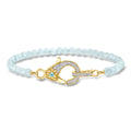 Gold-toned aquamarine bead bracelet with lobster clasp and blue gemstone, diamond accents