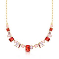 Gold-plated necklace with pink and red simulated gemstones and linked chain