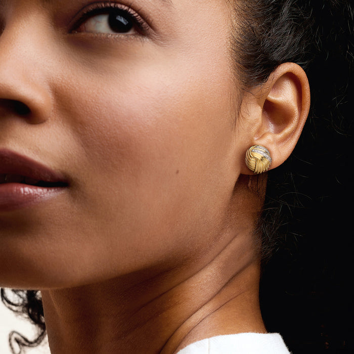 Diamond knot post earrings in gold-tone metal