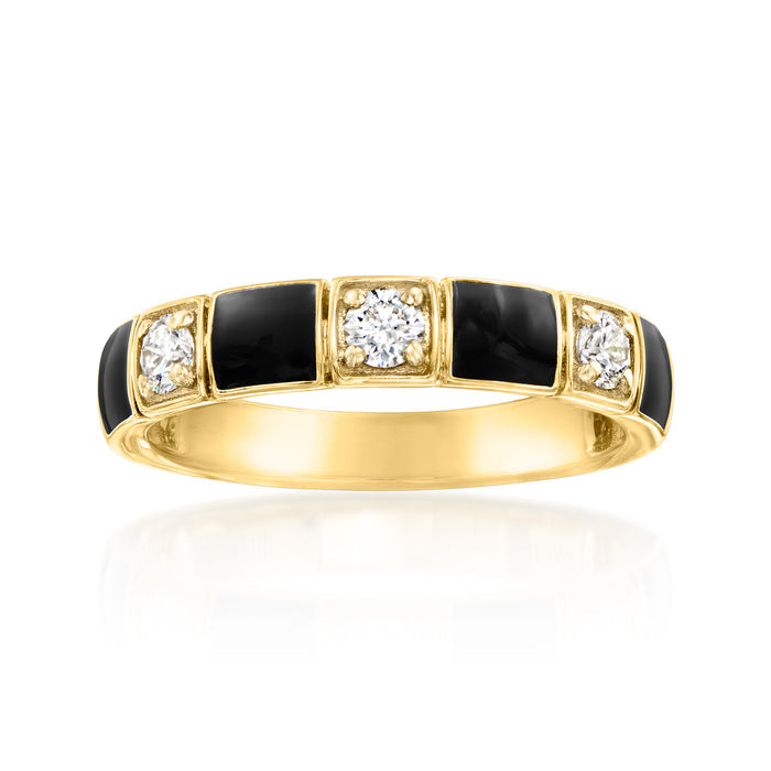 Gold-tone ring with black enamel pattern panels and four round diamond accents