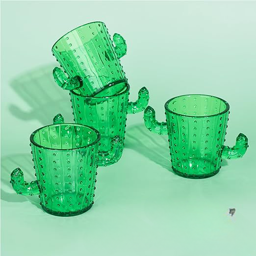 Angled view of 2 oz party size shot glass set of 5 showcasing green cactus designs on a pale green background