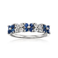 Sterling silver floral ring with blue sapphires and white gemstones, side view