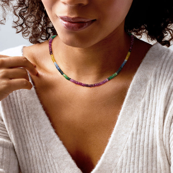 Multicolored bead sapphire necklace on model neckline, sterling silver chain