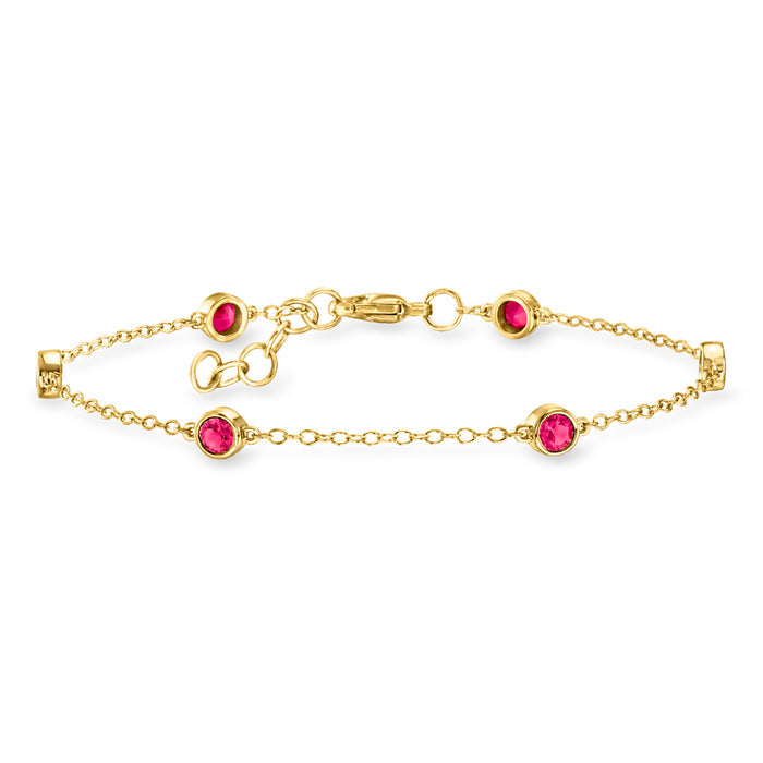Gold station bracelet with round pink gemstones and link chain with lobster clasp