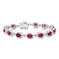Ruby and diamond bracelet in sterling silver with oval ruby stations and round accents