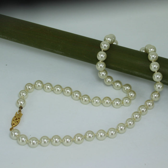 Classic Pearl Necklace Princess Length 18" Knotted 7.5mm Luminous Pearls table view