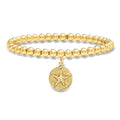 18kt gold over sterling bead stretch bracelet with sand dollar charm