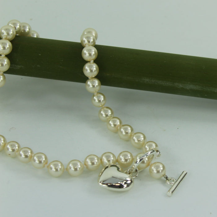 Single Strand Faux Pearl Necklace Silver Heart Bar Closure closeup view
