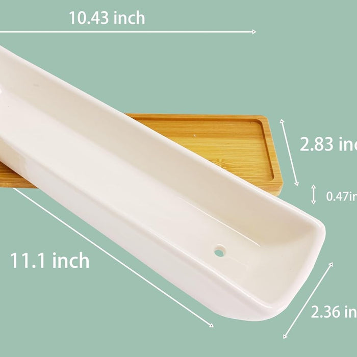 Angled view of white ceramic succulent planter with bamboo saucer, showing 11.1 by 2.36 by 1.77 inch dimensions