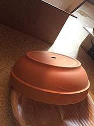 Terra Cotta Pot for cactus and succulents, shown upside down on a textured surface, with boxes and packing material in the background.