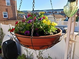 Front view of Terracotta Plastic Garden Planter showcasing its shallow bowl shape with colorful flowers and hanging chains